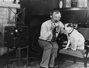Headsets: Man trying to talk to dog