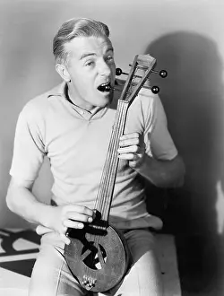 Miniatures: Man tuning a Turkish spike fiddle
