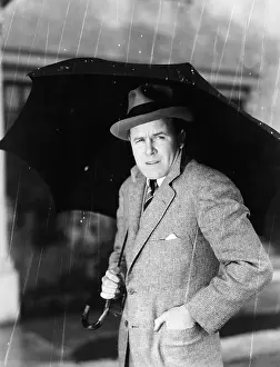 Chill: Man with an umbrella standing in the rain