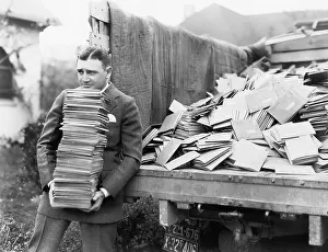 Employ: Man unloading a truck full of letters