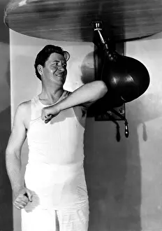 Workout: Man using punching bag