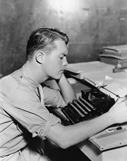 Compositions: Man using typewriter