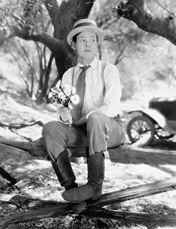 Suitor: Man waiting with bouquet of flowers