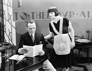 Menus: Man and waitress in restaurant