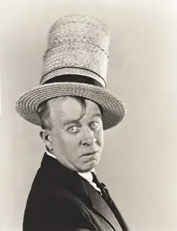 Stovepipe: Man wearing stovepipe straw hat