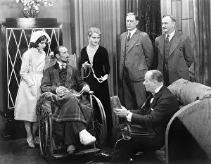 Sickly: Man in a wheel chair with a broken foot and a group