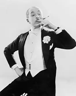 Lapel: Man in white tie posing with a cigarette