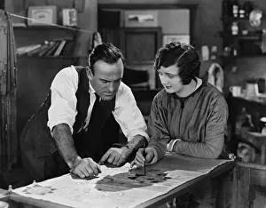 Blueprint: Man and woman collaborating on illustration