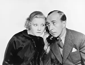 Insecure: Man and a woman eavesdropping on the telephone