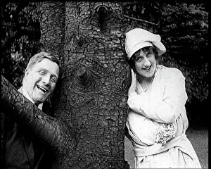 Lovingly: A Man and A Woman Hiding From Each Other Around