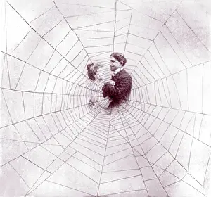 Entangled: Man and woman in middle of spider web to ?