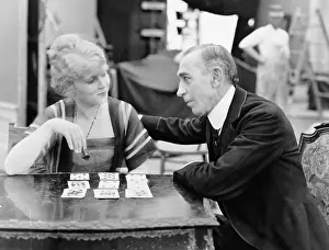 Advising: Man with woman playing card game