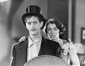 Woeful: Man and woman standing together looking sad