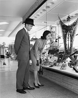 Nicely: Man and Woman Window Shopping