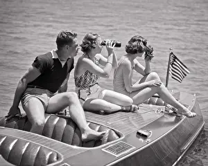 Teak: Man and Two Women Sitting on Deck of Runabout