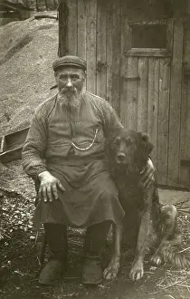 Sheds: Man in working clothes with a large dog