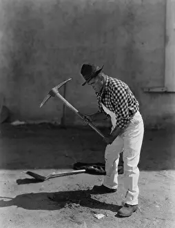 Minorities: Man working with pick axe