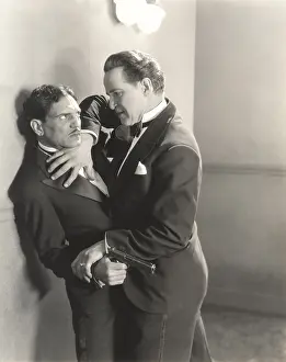Self Defense: Man wrestling gun out of other man's hand