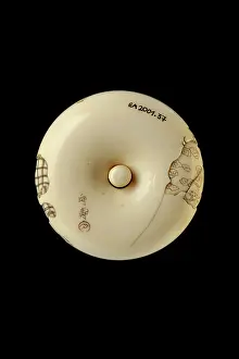 Kosai: Manju netsuke - a boy chasing away two oni, or demons