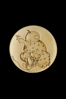 Korin: Manju netsuke with a boy playing with a spinning top