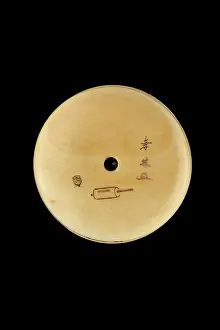 Pigment: Manju netsuke with a boy playing with a spinning top