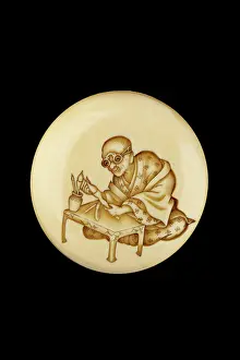 Calligrapher: Manju netsuke - a calligrapher