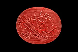 Manju: Manju netsuke with chrysanthemum and orchids