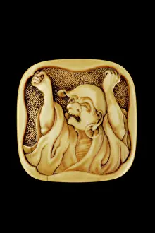 Daruma: Manju netsuke - Daruma stretching and yawning