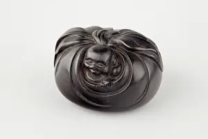 Manju: Manju netsuke in the form of Hotei peering from his sack