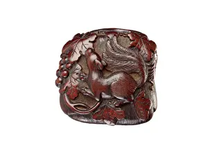 Grapevines: Manju netsuke in the form of a squirrel among grapevines