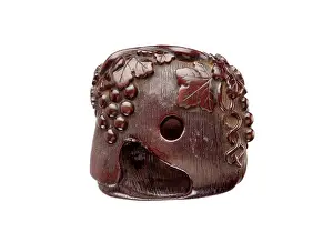 Manju: Manju netsuke in the form of a squirrel among grapevines