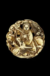 Netsuke: Manju netsuke - The Goddess Benten, riding a dragon