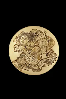 Netsuke: Manju netsuke - a karako blowing a trumpet