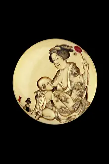 Staining: Manju netsuke - a mother feeding her baby