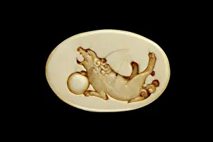 Netsuke: Manju netsuke with a shishi playing with a ball