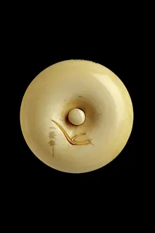 Netsuke: Manju netsuke - smiling priest about to prepare puffer fish