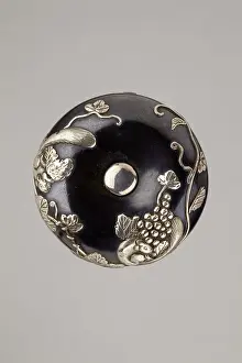 Shakudō: Manju netsuke with squirrel and grape vine