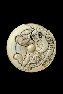 1187: Manju netsuke - Tadanobu defending himself with a go board