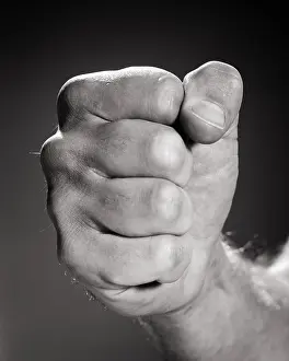 Man S: Man?s Fist Coming Towards the Camera Ready For