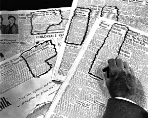 Camerique: Man's Hand Circling Articles in Newspapr