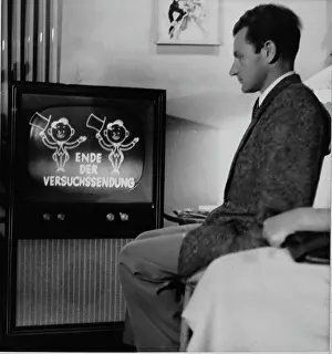 Televisions: Mansitting in front of a TV (test transmission)