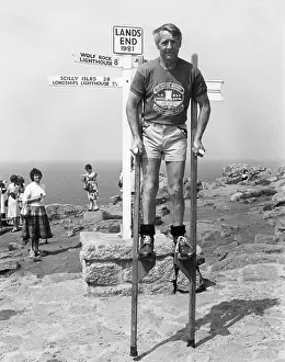 Teeshirt: Marathon stilt walker at Land's End, Cornwall