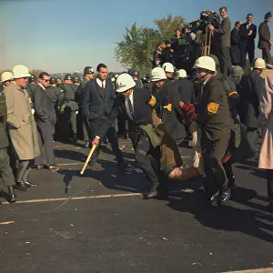 Protester: March on the Pentagon. US Marshals bodily ?