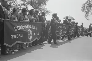 Minority: Marchers carrying labor union banners during