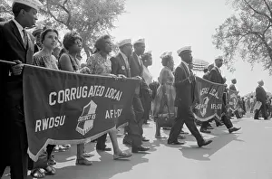 Minority: Marchers carrying labor union banners during