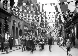 Pennants: Marching band of German Youth in procession