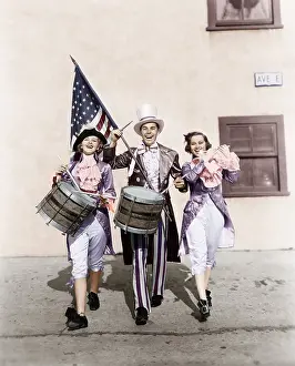 Cooperate: Marching band performing in a parade with an American flag