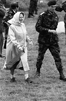 Thatcher: Margaret Thatcher walking with a soldier