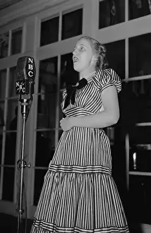 Lcgr1308: Margaret Truman, singing into a NBC Microphone