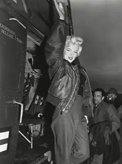Marilyn Monroe arriving by helicopter at a U.S